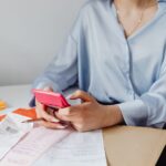 Retiree reviewing bank statements to audit monthly subscriptions