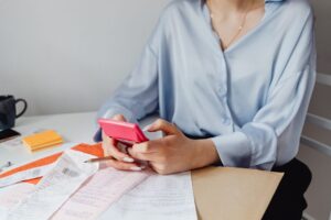 Retiree reviewing bank statements to audit monthly subscriptions