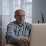 Senior driver completing the AARP Smart Driver course online at home