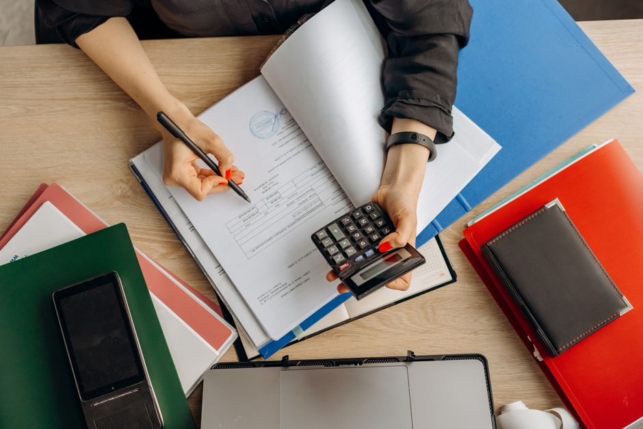 Person reviewing paperwork to calculate ABLE account tax credit savings