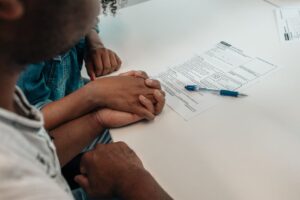 Family reviewing adoption paperwork and Form 8839 at home