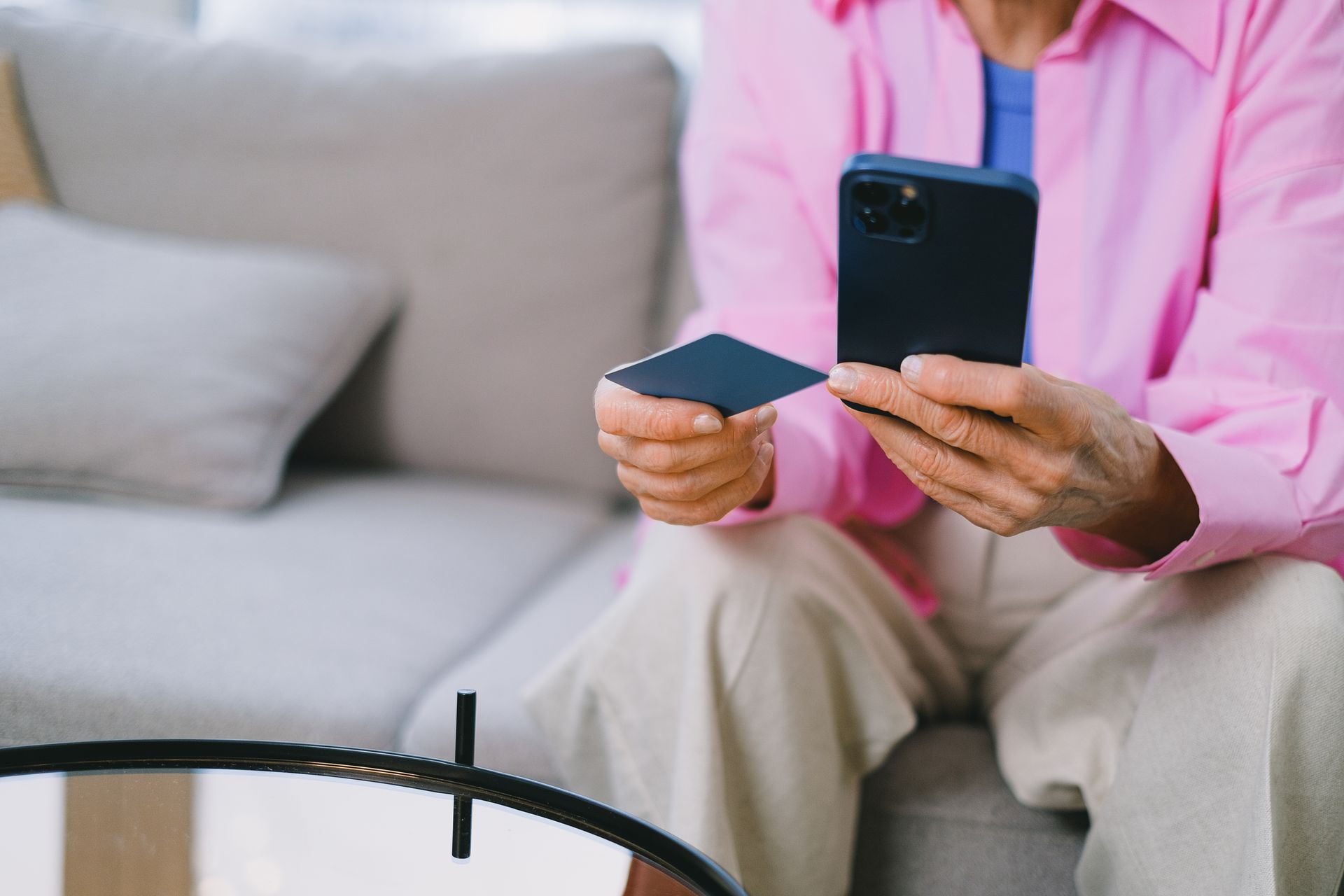 Retiree checking a fee-free banking app on a smartphone
