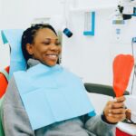 Adult patient at a dental checkup covered by the Canadian Dental Care Plan 2026
