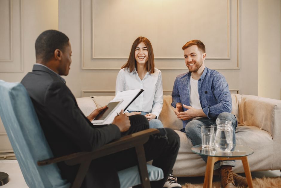 credit counselor reviewing a personalized debt management plan with a client