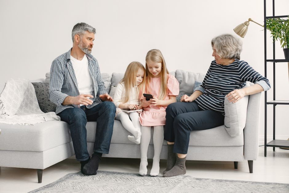 Happy family spending time together at home, representing financial relief from tax credits