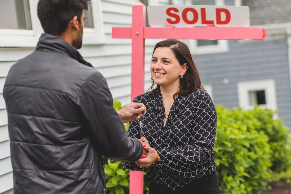 new homeowner receiving keys after using FHSA for first home purchase