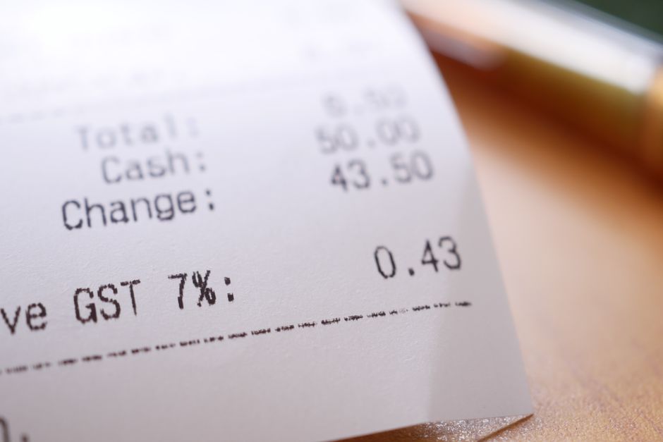 Comparison of grocery store receipts and loyalty cards showing senior discount savings