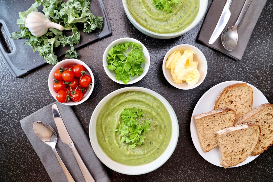 Homemade soup and fresh in-season vegetables prepared for weekly meal planning