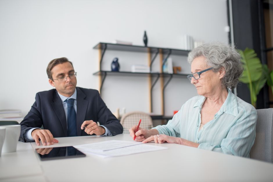 Senior receiving guidance at a local Area Agency on Aging service desk