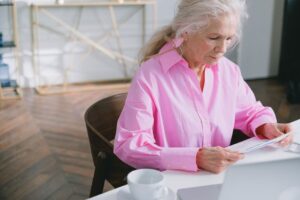 Older adult reviewing legal documents before a free consultation