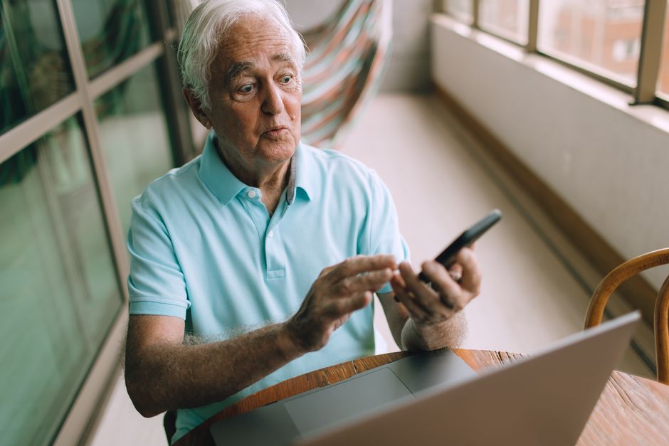 OTC hearing aid device being paired with a smartphone app for adjustment