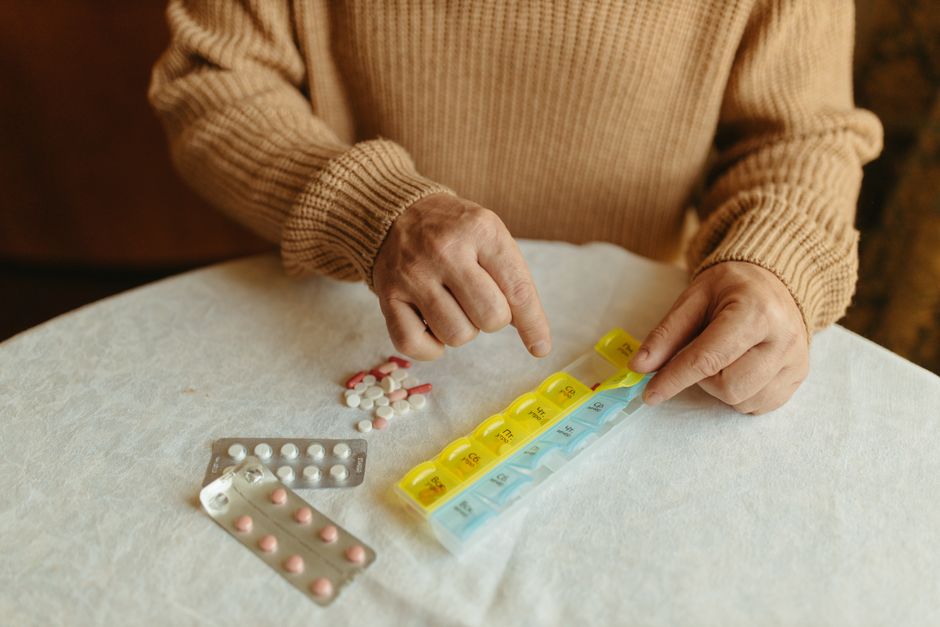 Senior organizing prescription medications covered under Medicare Extra Help