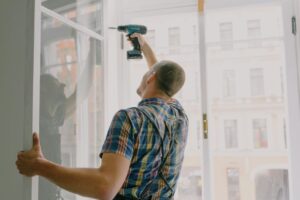 homeowner reviewing energy-efficient home improvement upgrades like insulation and windows