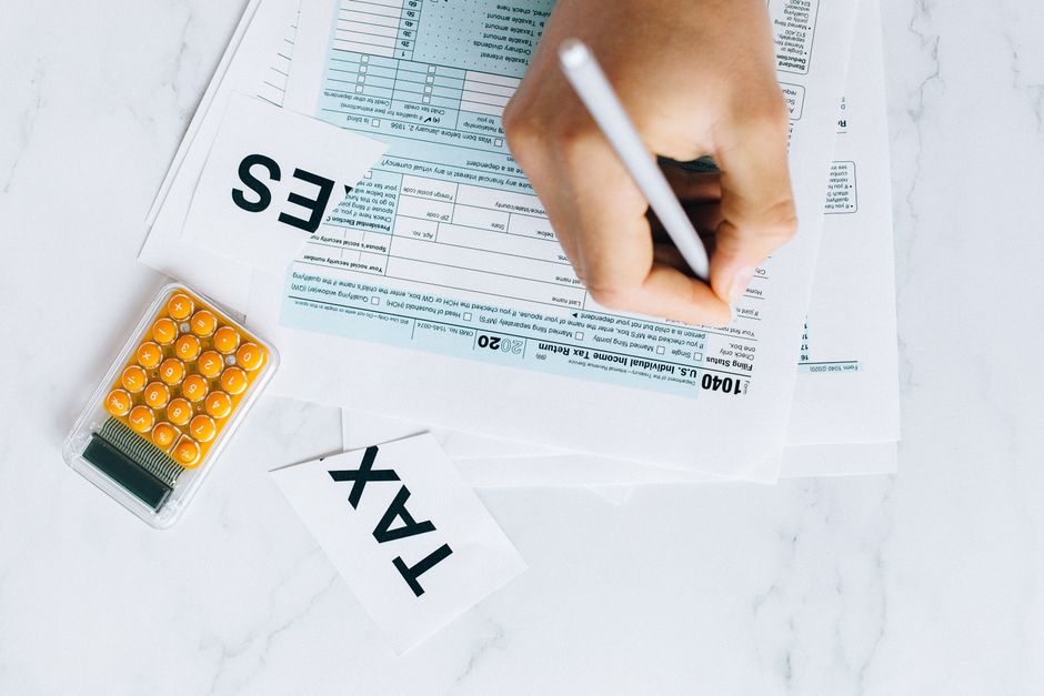 homeowner filling out IRS Form 5695 to claim the energy home improvement credit for 2025