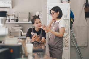 Hourly worker checking retirement savings account on phone