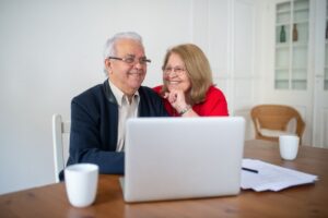 Senior couple reviewing 2026 tax documents at home