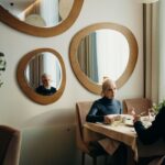 Senior couple smiling while looking at a restaurant menu