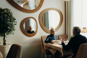 Senior couple smiling while looking at a restaurant menu