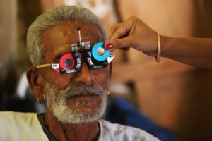 senior man having a free eye exam at an ophthalmologist office