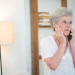 Older adult reviewing a suspicious phone call as a possible scam targeting seniors