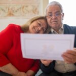 Retired teacher reviewing Social Security Fairness Act back pay documents at home
