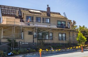 Rural home with roof and siding being repaired under USDA Section 504 program