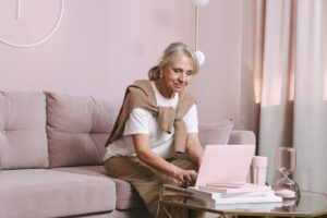 Older adult checking Amazon Prime Access eligibility on a laptop