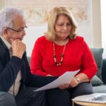 senior couple reviewing Texas homestead exemption paperwork at home