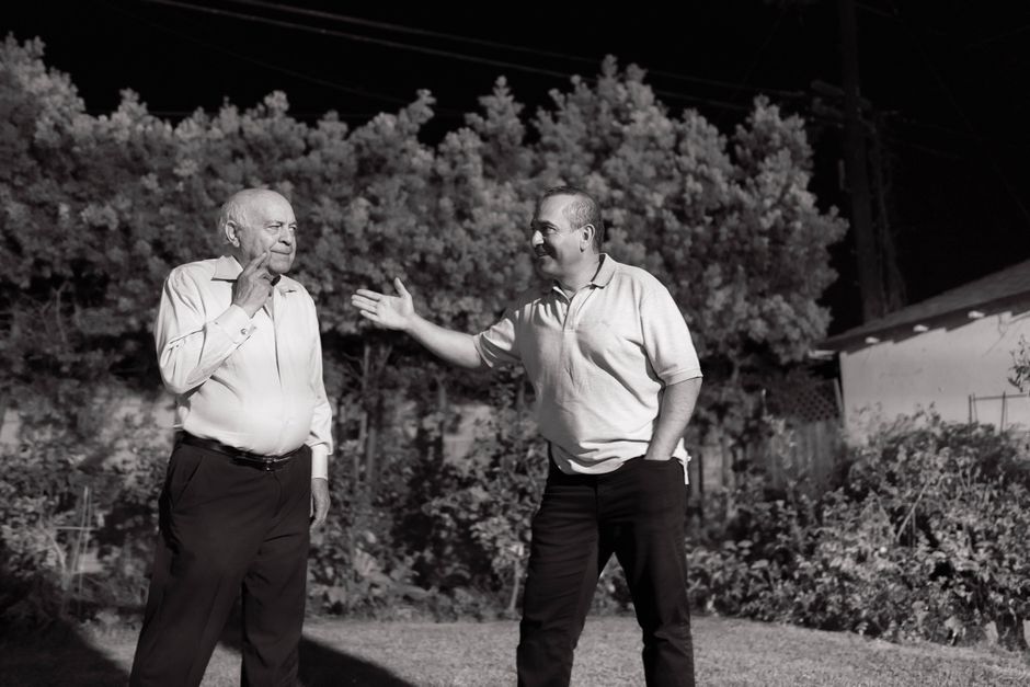 Adult son spending time with his elderly father, an eligible dependant under the Canada Caregiver Credit