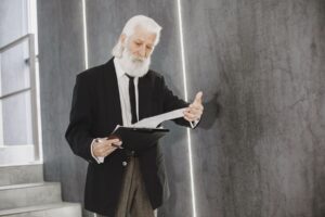 Retiree reviewing CPP Post-Retirement Benefit paperwork while working part-time