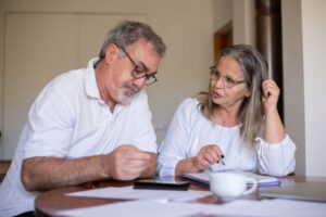 Senior couple reviewing CPP survivor's pension paperwork
