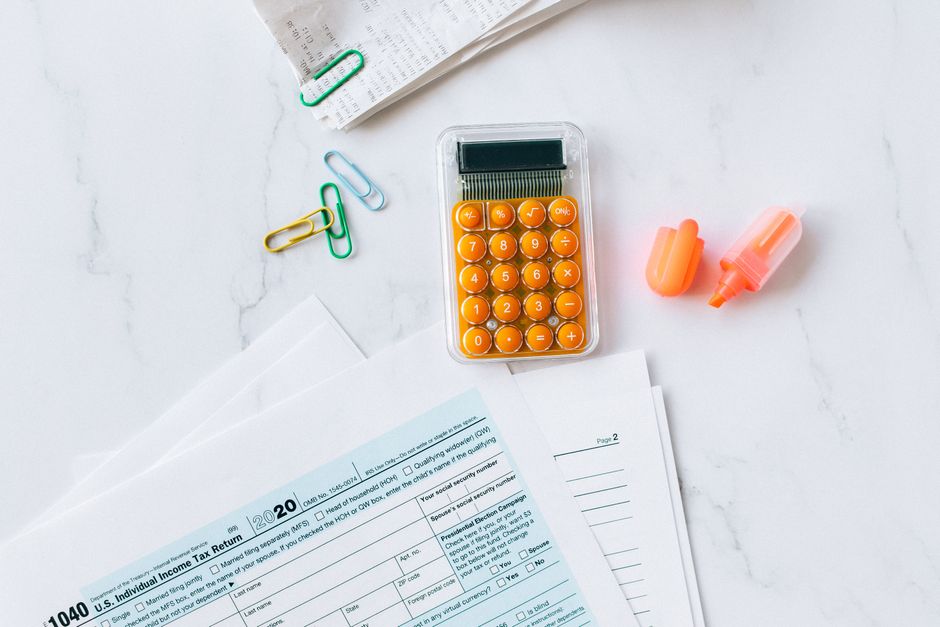 Calculator and Form 2441 tax paperwork used to figure the dependent care credit