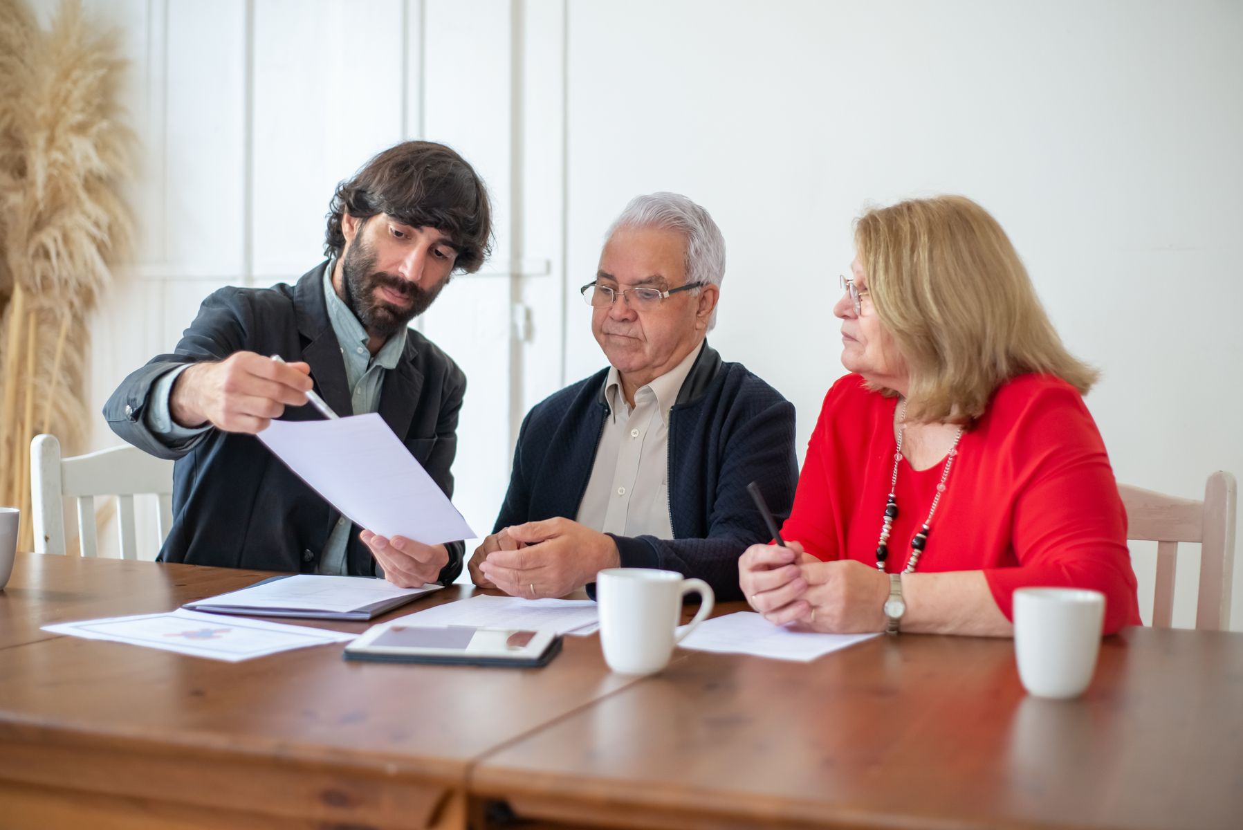 Senior homeowner discussing home repair and modification program options with a caseworker