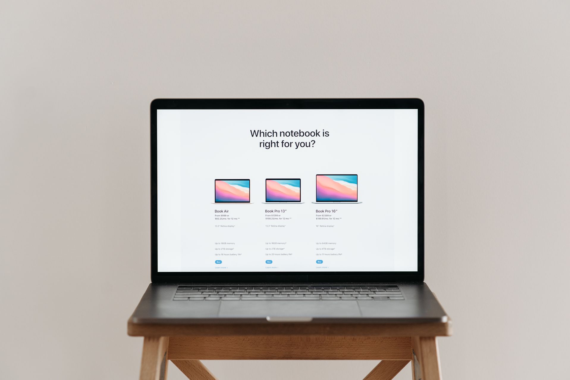 Laptop showing online car price comparison tool