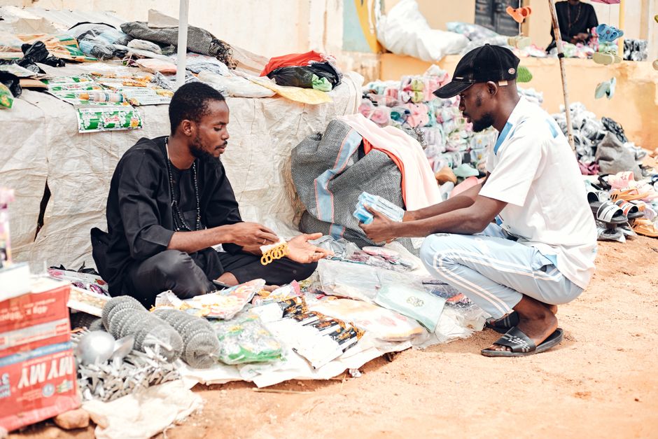 Two people meeting in a parking lot to complete a safe marketplace item exchange
