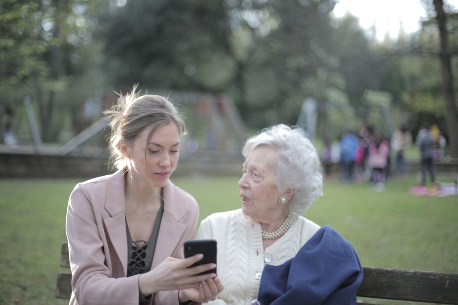Adult child helping a parent compare medical alert system options
