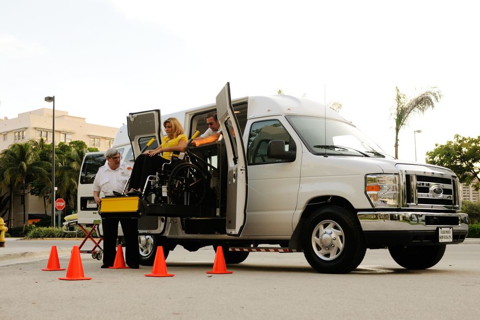 Wheelchair-accessible paratransit van at curbside pickup