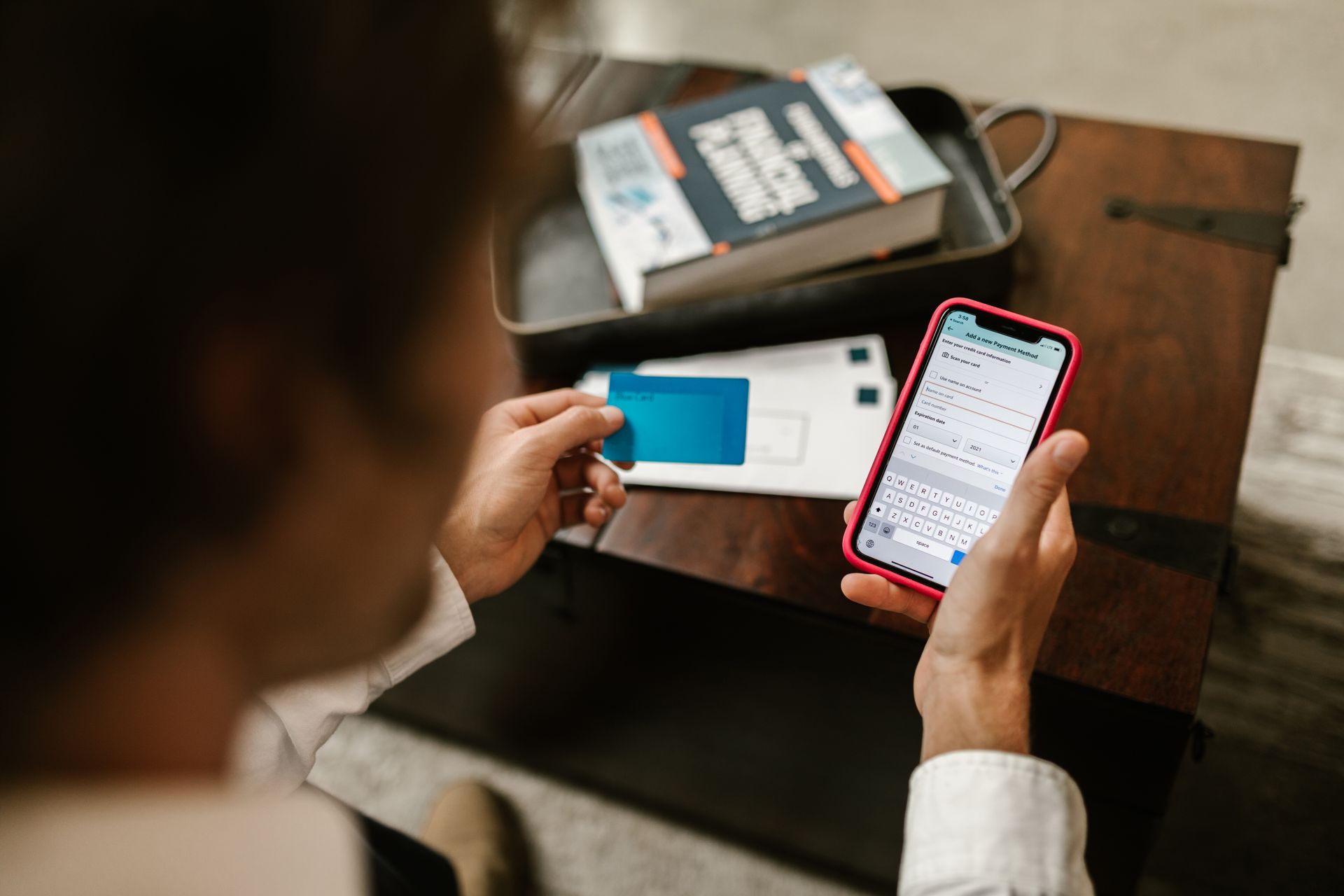 Person checking phone for Alaska PFD direct deposit notification