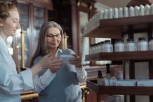 Senior shopper browsing pharmacy aisle for a monthly senior discount day