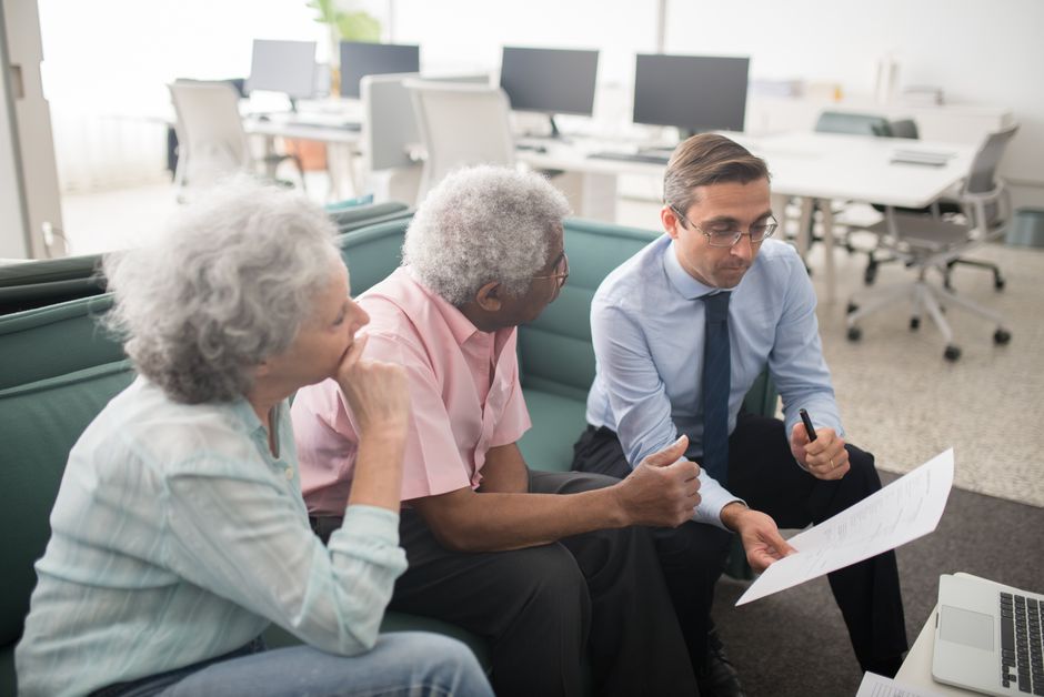 Tax advisor reviewing paperwork with a retired client