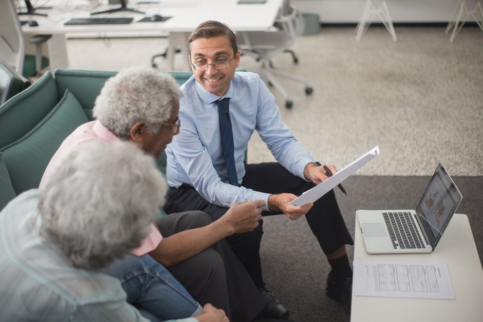 Retiree reviewing RRSP to RRIF conversion paperwork with a financial advisor