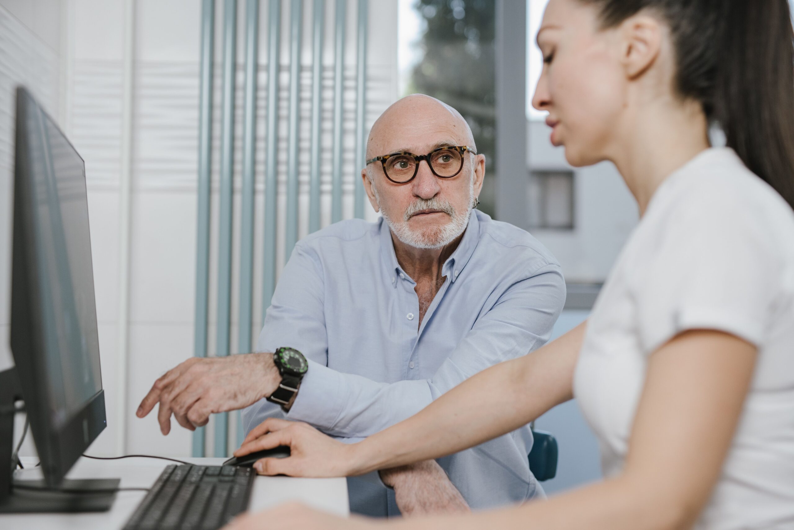 Senior receiving a Medicare annual wellness visit at a doctor's office