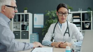 Senior patient discussing a personalized prevention plan with a doctor during a Medicare Annual Wellness Visit