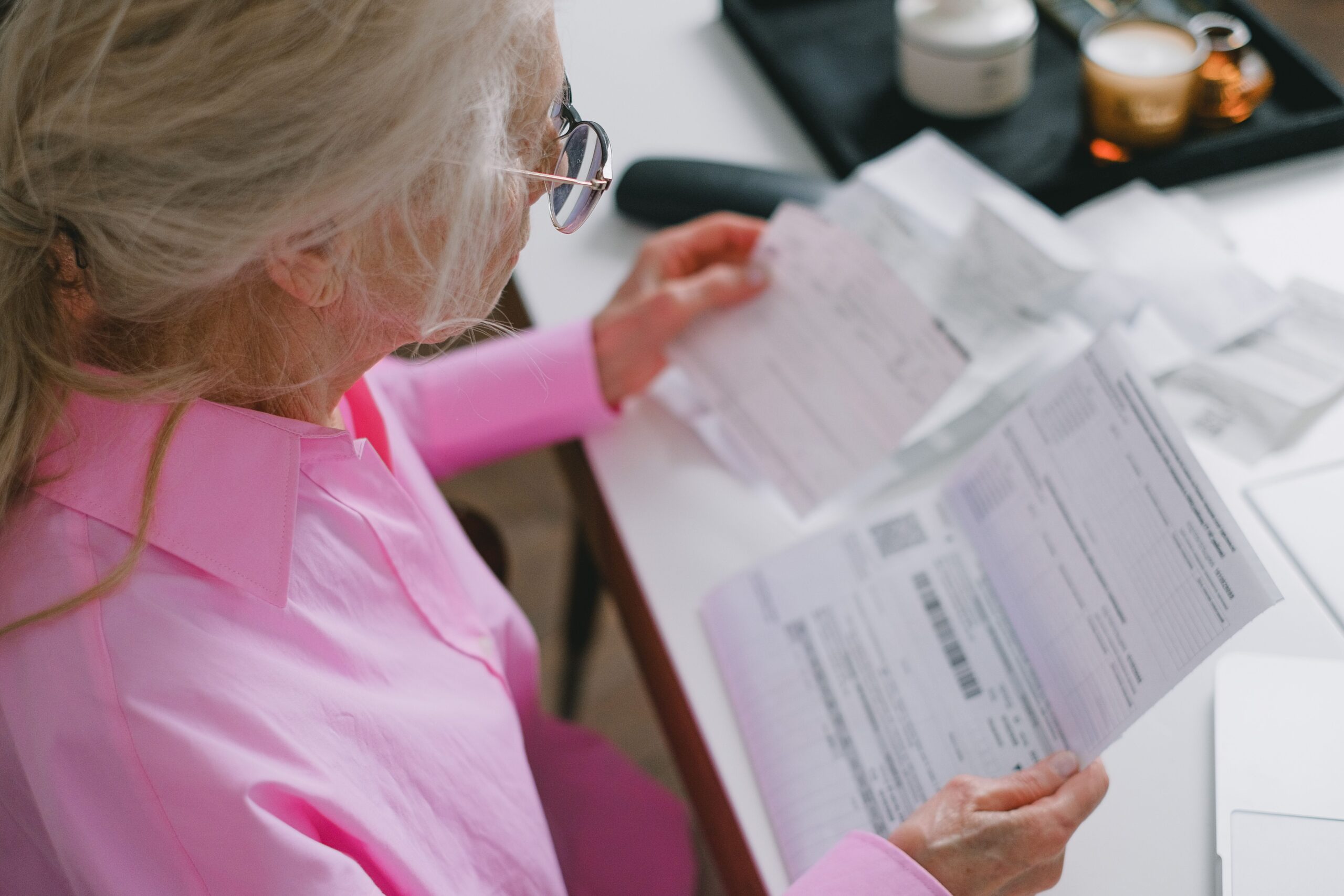 Senior checking mail for a Service Canada benefit letter