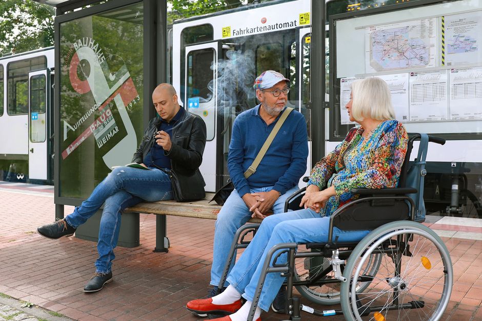 Senior using accessible public transit bus ramp