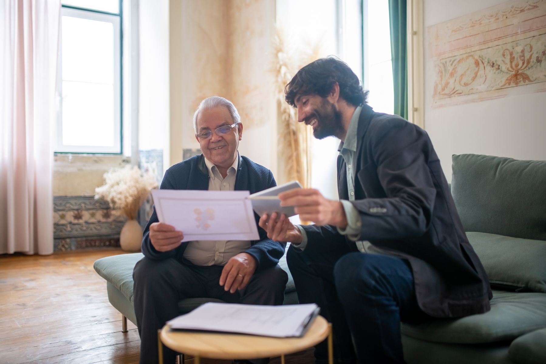 applicant discussing SSDI application paperwork with a representative