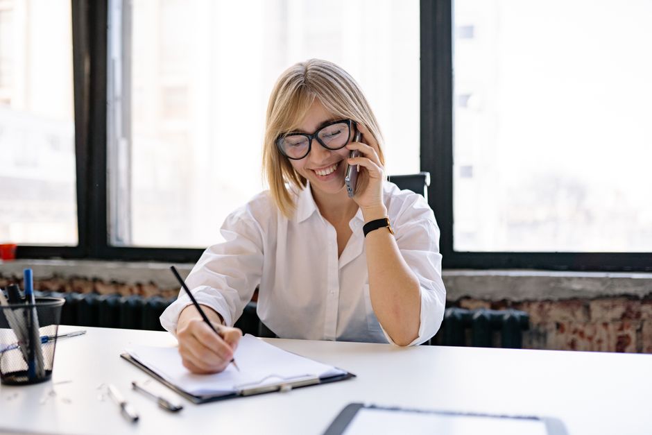 Surviving spouse on the phone with Social Security Administration discussing benefit options