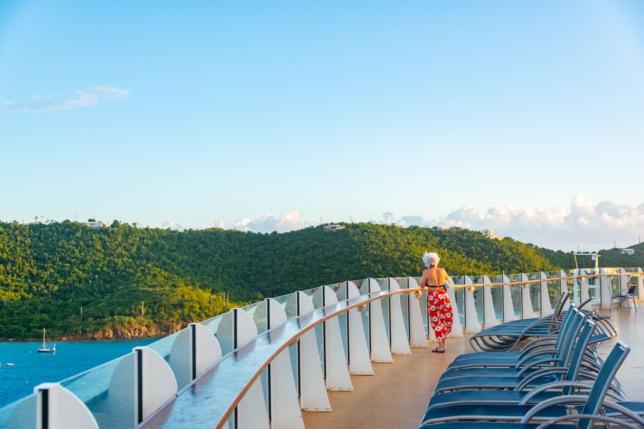 Senior traveler enjoying a cruise vacation booked using AARP discounts