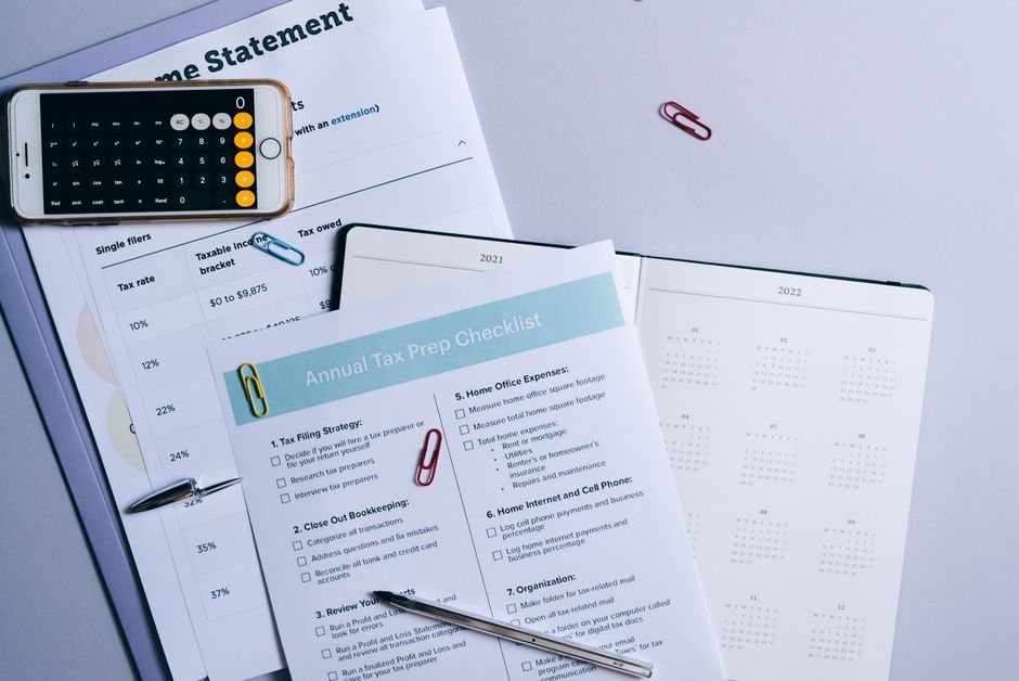 Monthly retirement budget checklist and calculator on a desk