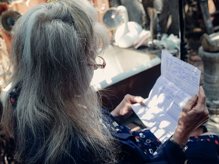 elderly Michigan homeowner checking a property tax statement in the mail